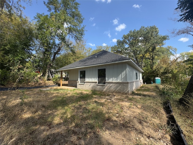 view of property exterior featuring a shed