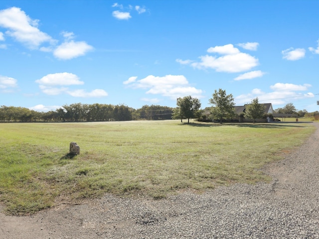 view of yard with a rural view