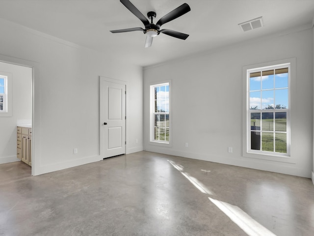 empty room with ceiling fan and ornamental molding