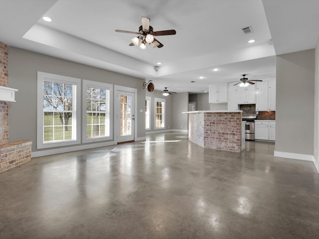 unfurnished living room featuring a fireplace and concrete floors