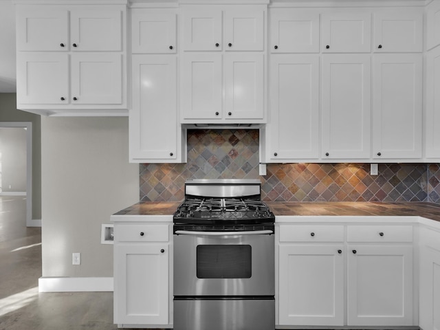 kitchen featuring white cabinets, decorative backsplash, and stainless steel range with gas stovetop