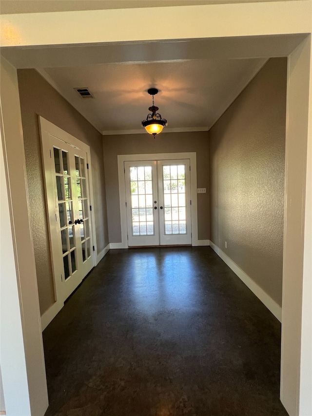 entryway featuring french doors and ornamental molding