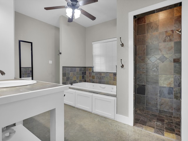 bathroom featuring plus walk in shower, vanity, and ceiling fan