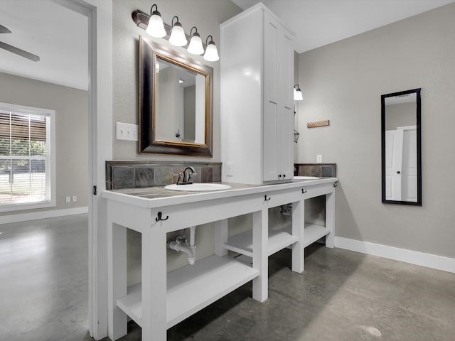 bathroom featuring backsplash, vanity, and concrete floors