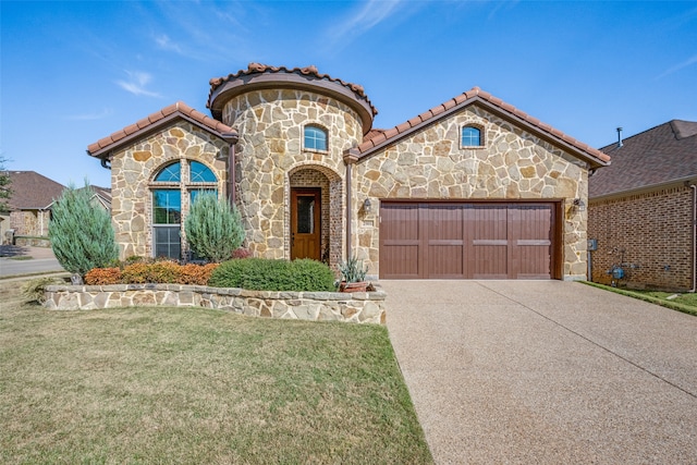 mediterranean / spanish-style house featuring a front lawn and a garage