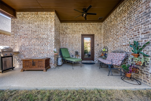 view of patio featuring a grill and ceiling fan