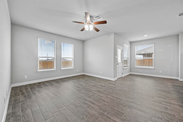 interior space featuring a wealth of natural light and dark hardwood / wood-style flooring