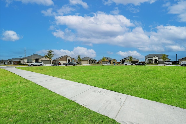 view of home's community featuring a lawn