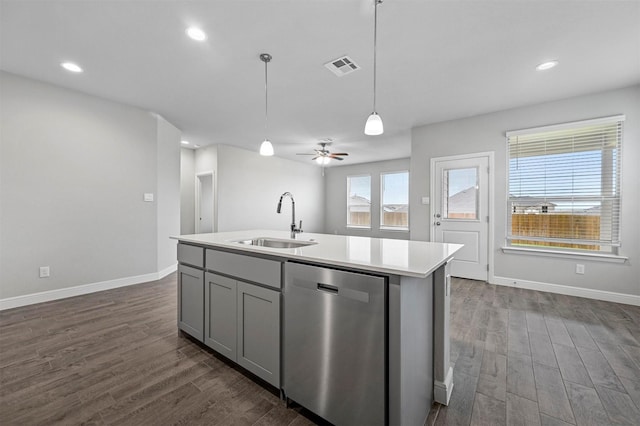 kitchen with dark wood-style flooring, dishwasher, a sink, gray cabinetry, and visible vents
