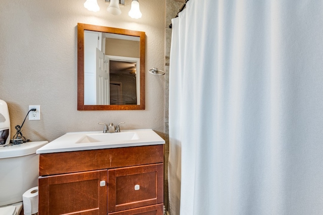 bathroom with vanity and toilet