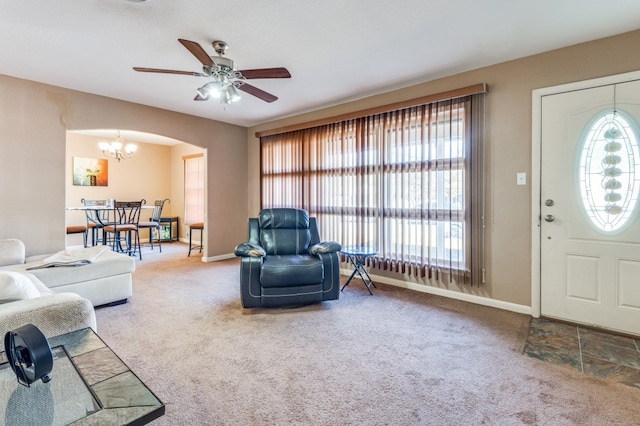 living room with ceiling fan and carpet floors