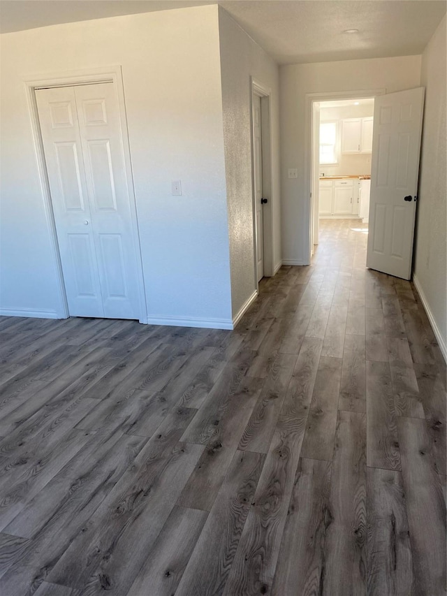 hall with dark hardwood / wood-style floors