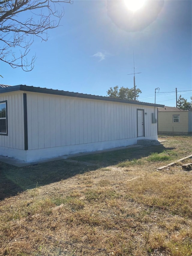 view of outbuilding featuring a yard