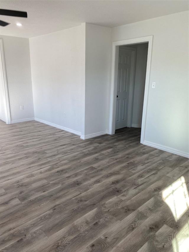 unfurnished room with dark hardwood / wood-style floors