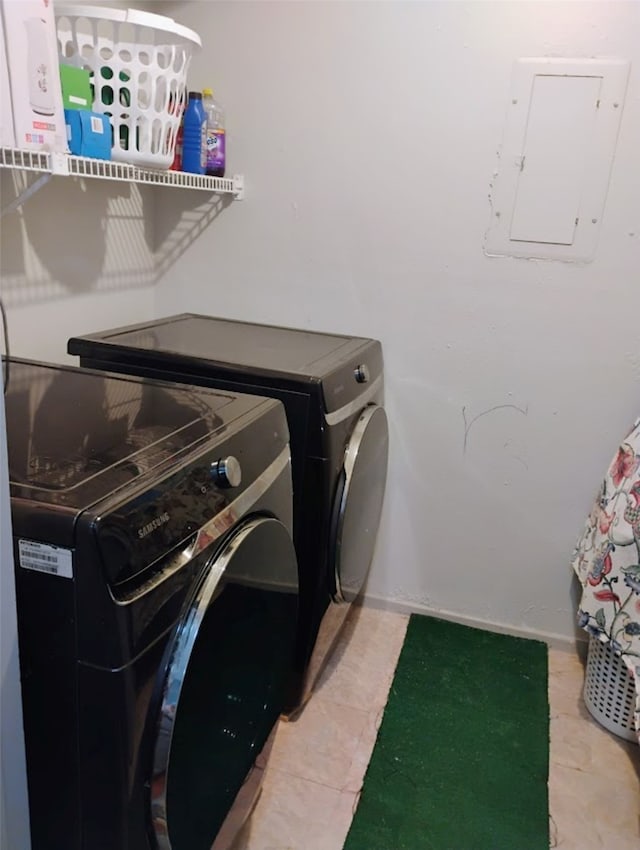 washroom featuring electric panel and independent washer and dryer