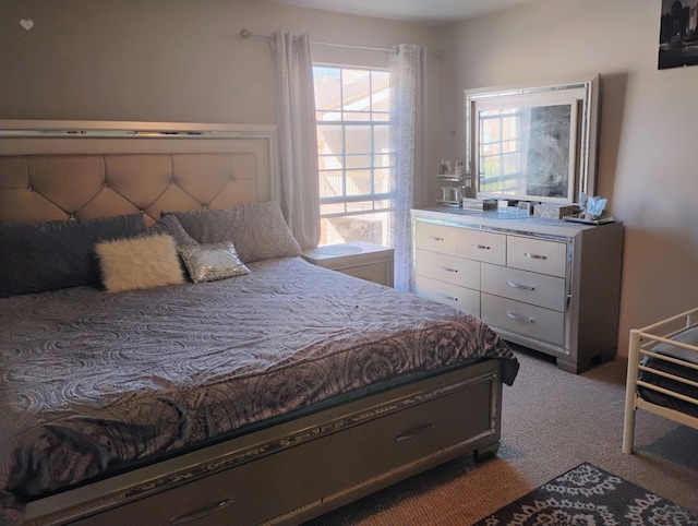 bedroom with light colored carpet