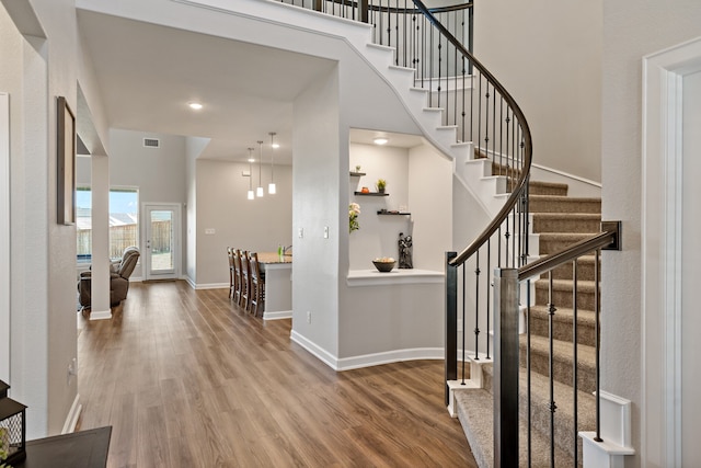 entryway with hardwood / wood-style flooring