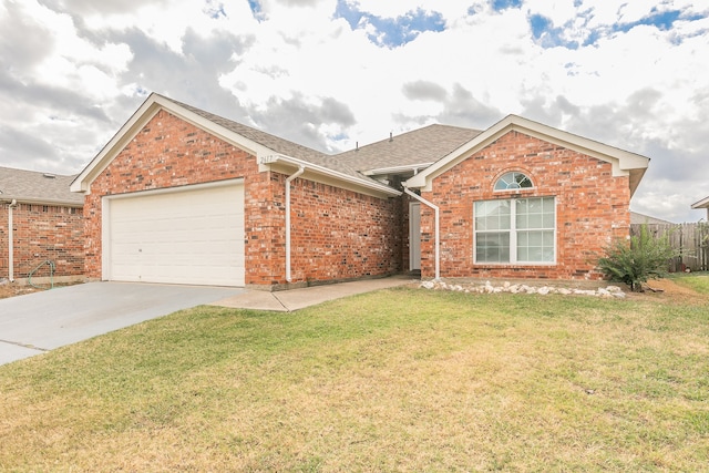 view of front of house with a front lawn and a garage