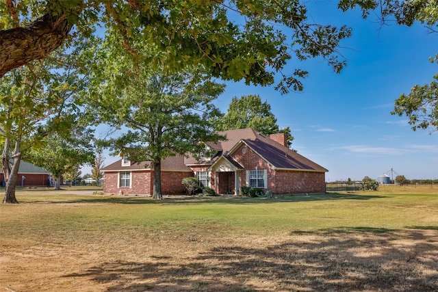 ranch-style house with a front lawn