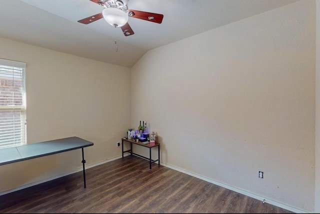 miscellaneous room featuring dark wood-type flooring, ceiling fan, and lofted ceiling