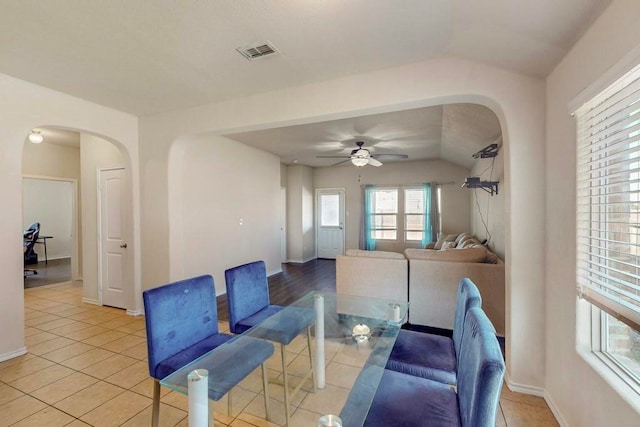 tiled dining area featuring ceiling fan