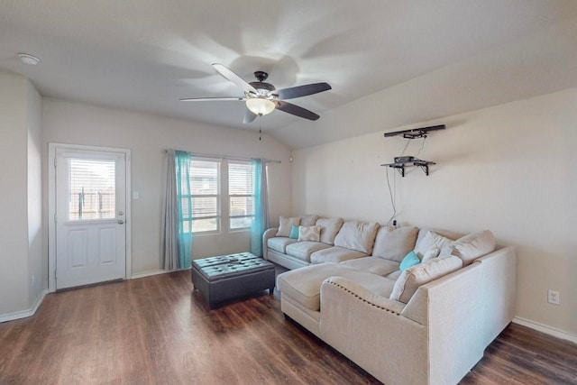 living room featuring ceiling fan, dark hardwood / wood-style flooring, and vaulted ceiling