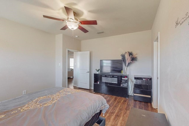 bedroom with ceiling fan and dark hardwood / wood-style floors