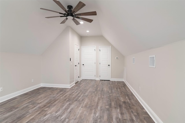 additional living space featuring ceiling fan, dark wood-type flooring, and lofted ceiling