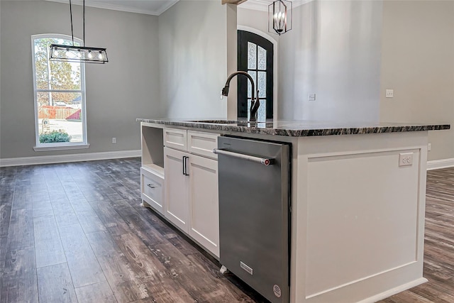 kitchen with dark hardwood / wood-style flooring, a center island with sink, white cabinetry, and hanging light fixtures