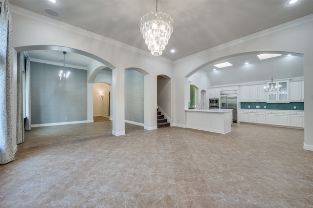 unfurnished living room with sink and ornamental molding