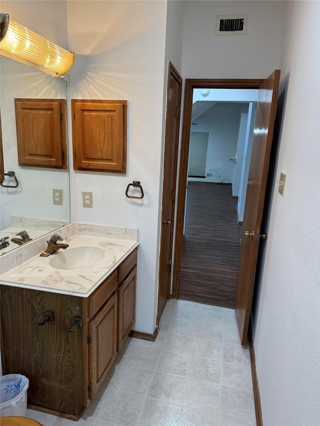 bathroom featuring vanity and tile patterned flooring