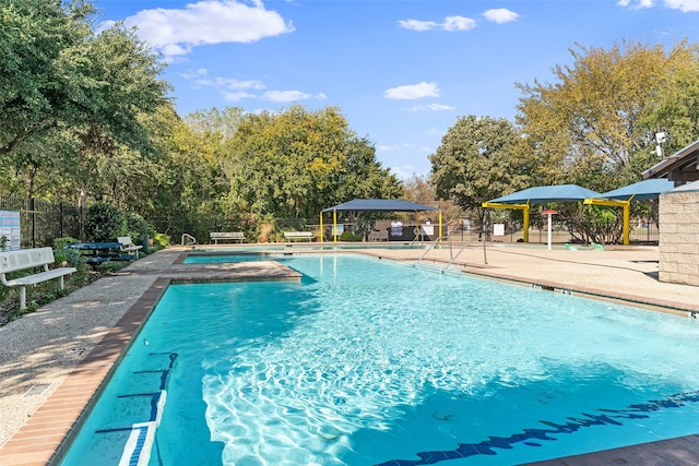 view of swimming pool featuring a gazebo and a patio