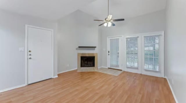 unfurnished living room featuring light wood-type flooring and ceiling fan