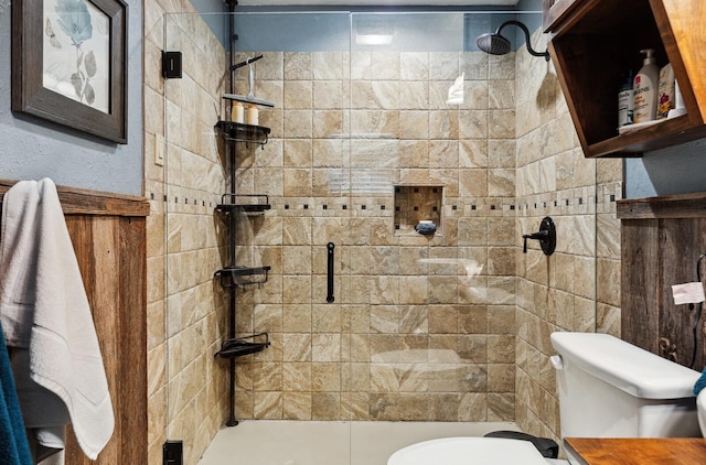 full bathroom with a stall shower and toilet
