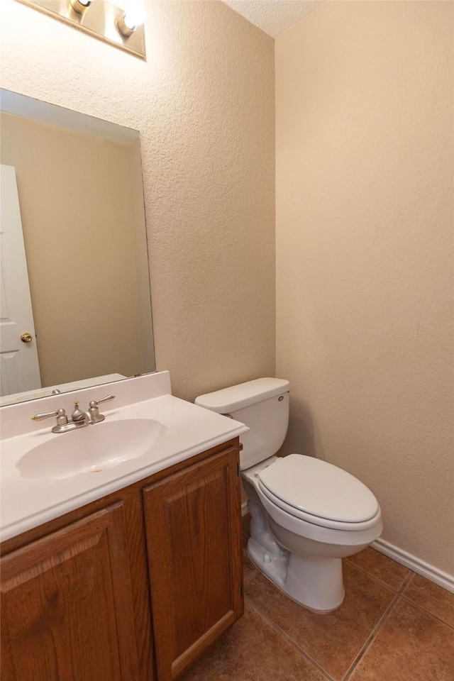 4309 Sarasota Ln, Mckinney, TX 75070 - half bath with toilet, a textured wall, tile patterned flooring, and vanity