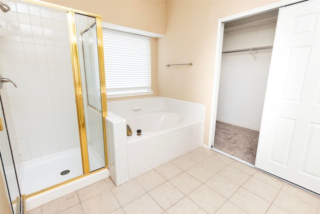 bathroom with plus walk in shower and tile patterned flooring