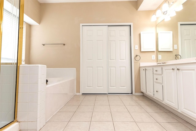 4309 Sarasota Ln, Mckinney, TX 75070 - full bath featuring a washtub, baseboards, tile patterned flooring, and vanity