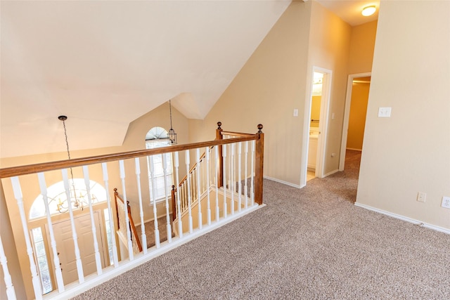 4309 Sarasota Ln, Mckinney, TX 75070 - hall featuring a notable chandelier, carpet floors, baseboards, an upstairs landing, and lofted ceiling