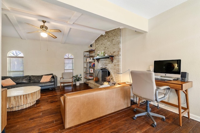 office area featuring a fireplace, ceiling fan, dark wood-type flooring, and lofted ceiling with beams