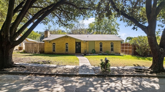 ranch-style home with a front yard