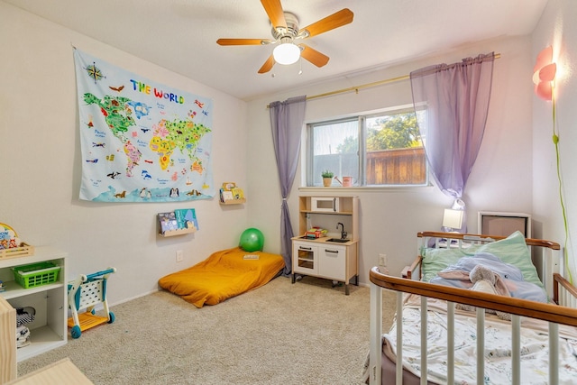 carpeted bedroom featuring ceiling fan