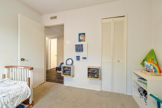 carpeted bedroom with a closet