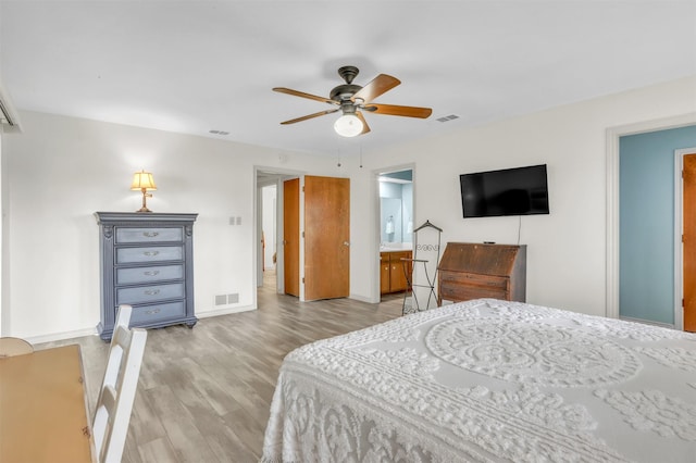 bedroom with ceiling fan and light hardwood / wood-style floors