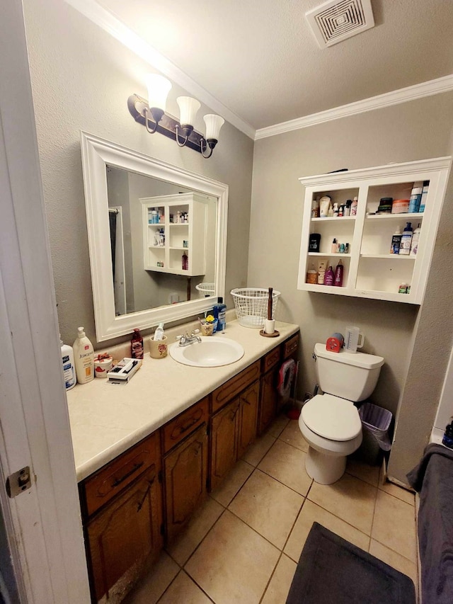 bathroom with a textured ceiling, toilet, ornamental molding, vanity, and tile patterned floors