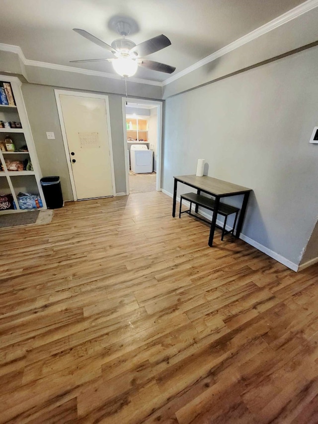 interior space featuring washer / dryer, ceiling fan, crown molding, and light hardwood / wood-style flooring