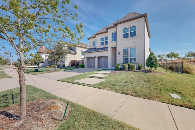 view of front facade featuring a front yard and a garage