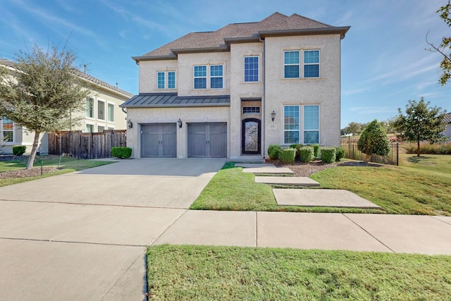 view of front of house with a front lawn and a garage