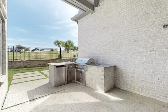 view of patio / terrace with area for grilling, sink, and grilling area