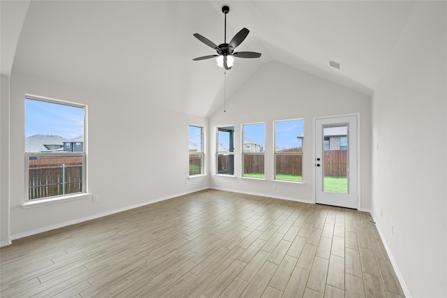 unfurnished living room with ceiling fan, high vaulted ceiling, and light hardwood / wood-style floors