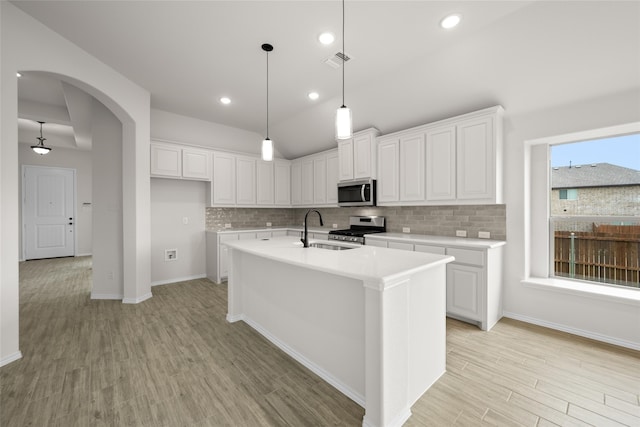 kitchen featuring sink, white cabinets, and stainless steel appliances